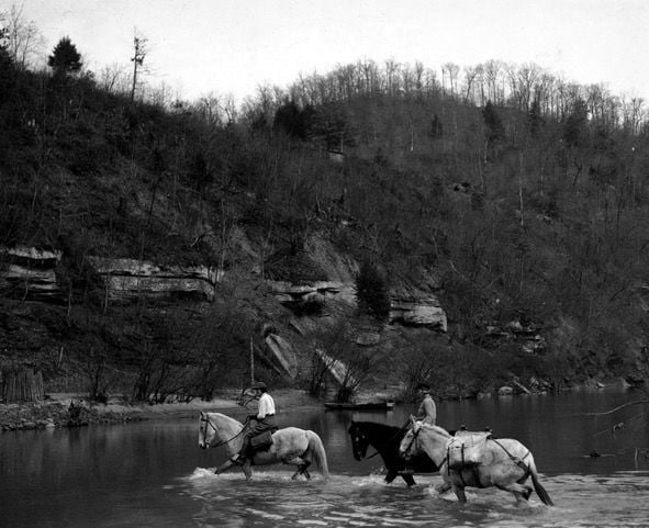 FNS couriers crossing a river